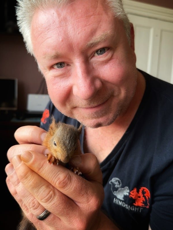 Save Our Reds ambassador Terry Abraham holding a red squirrel
